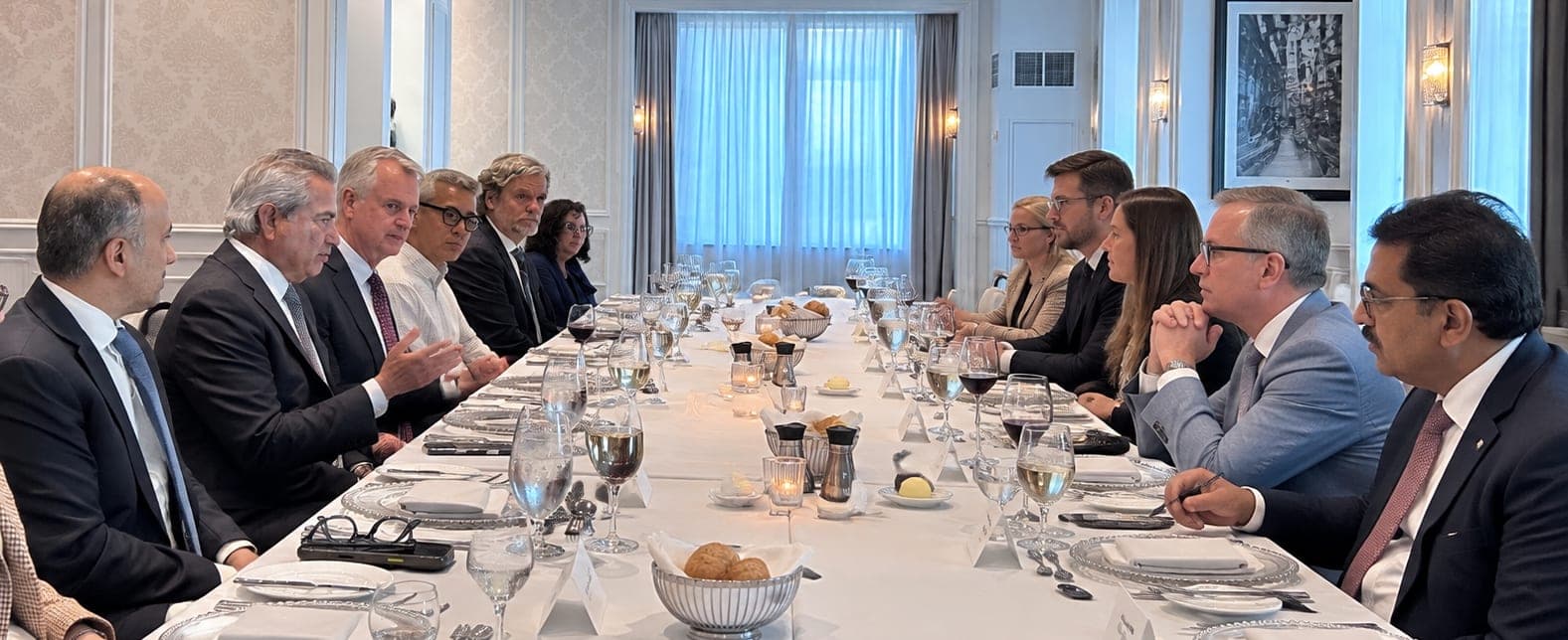 Business and policy leaders in discussion around the table at the Executive Roundtable